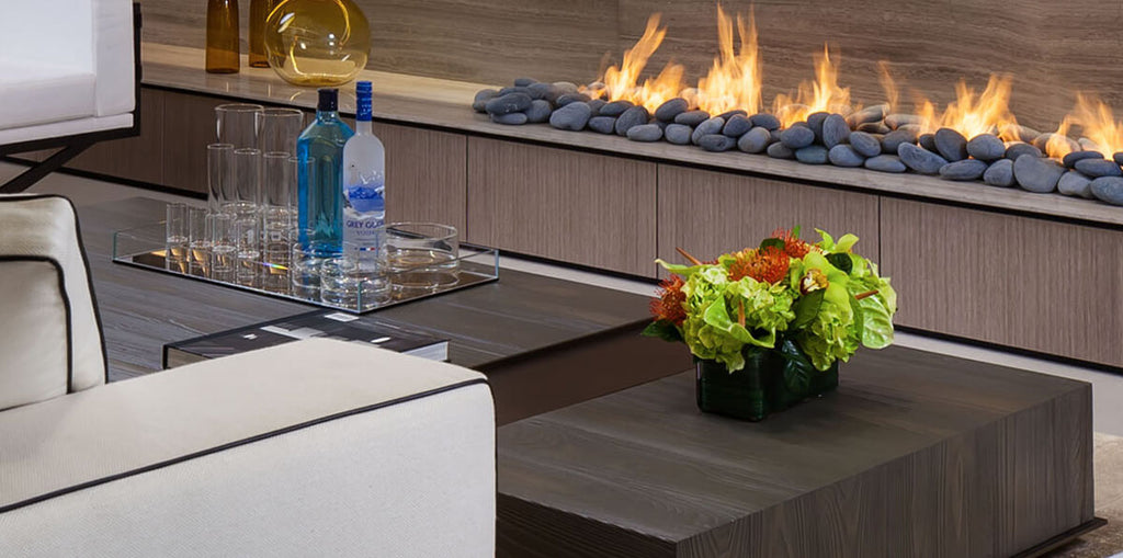 Havana Table with modern linear fireplace, decorative stones, and flickering flames