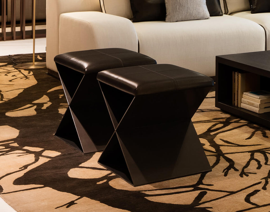 Santorini Stool with two dark brown leather ottomans featuring unique X-shaped bases