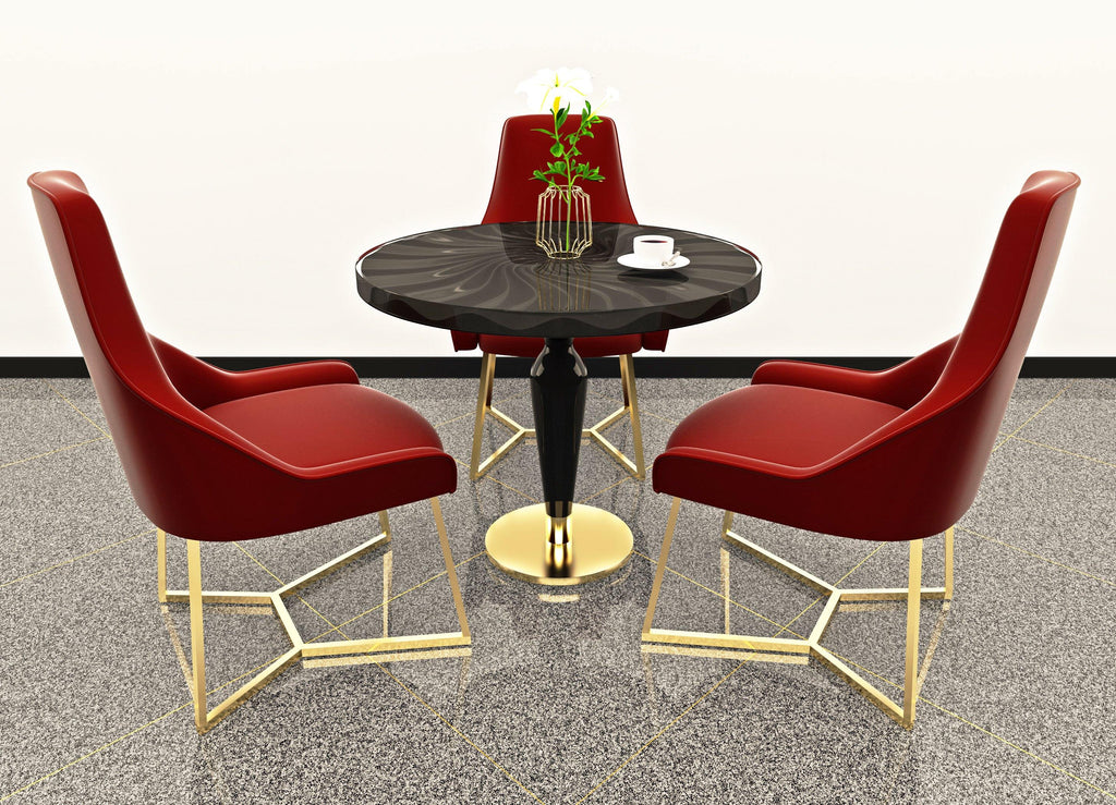 Black Ballerina Dining Table with lacquered wood top and gold-accented base surrounded by red upholstered chairs