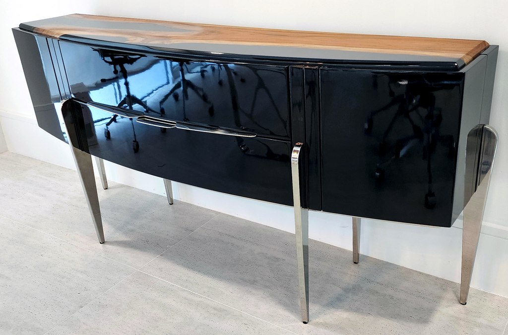 Black Padua Console with glossy black body, light wood top, and chrome legs