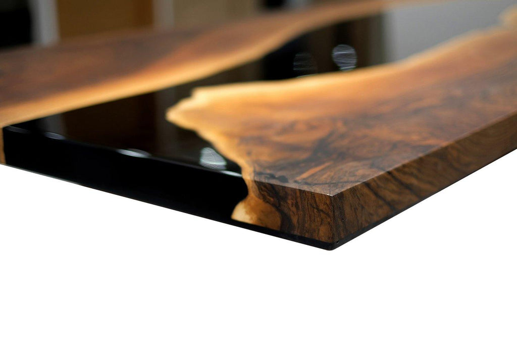 Live-edge wood and resin river table featuring Black Thyria River Walnut design