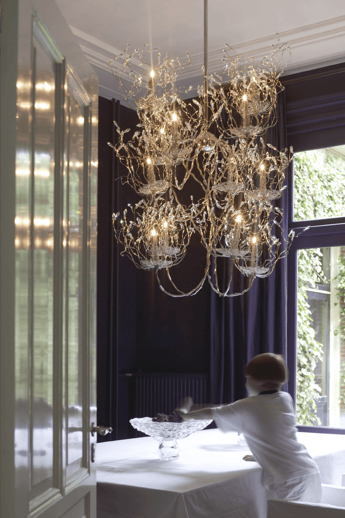 Ornate multi-tiered crystal spirits chandelier round with nature-inspired design