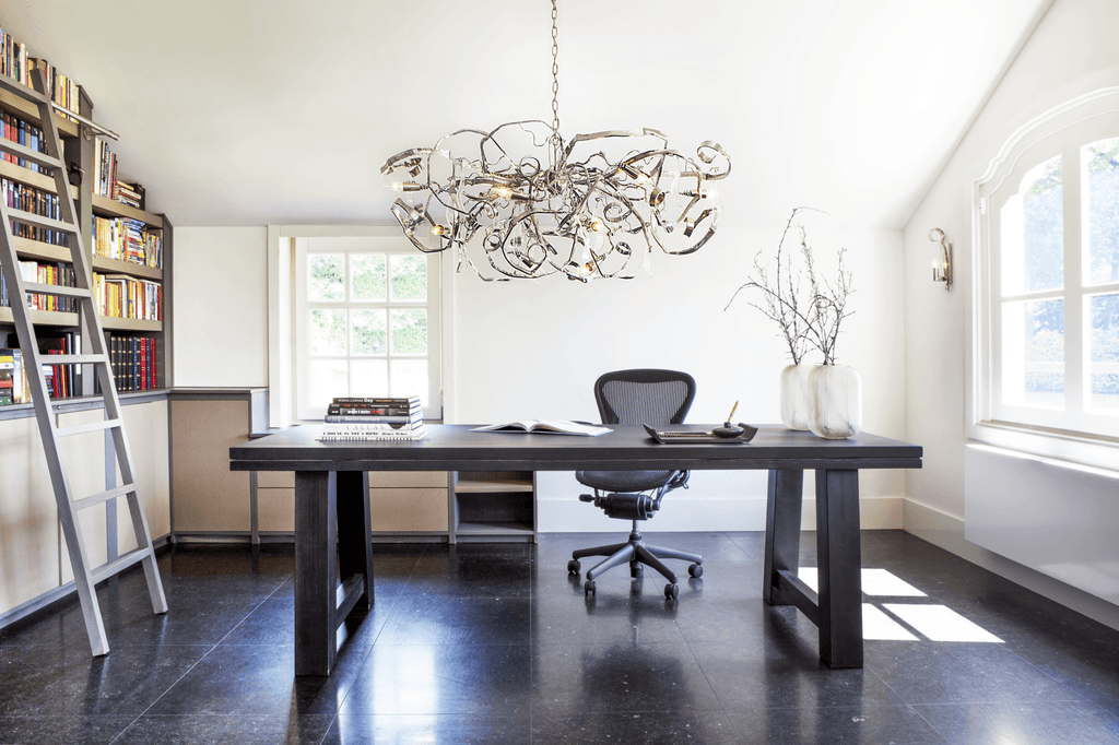 Modern office with Delphinium Chandelier Oval hanging above dark wood desk and black ergonomic chair
