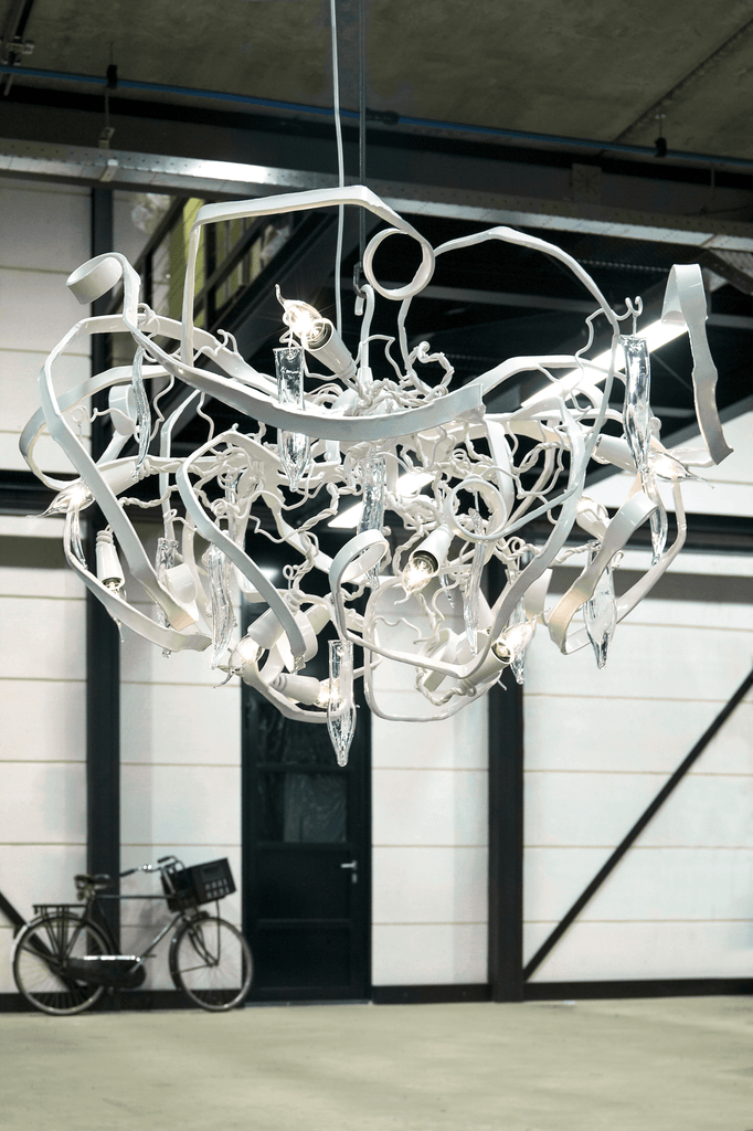 Delphinium Chandelier Round featuring an elaborate white modern chandelier with flowing abstract designs