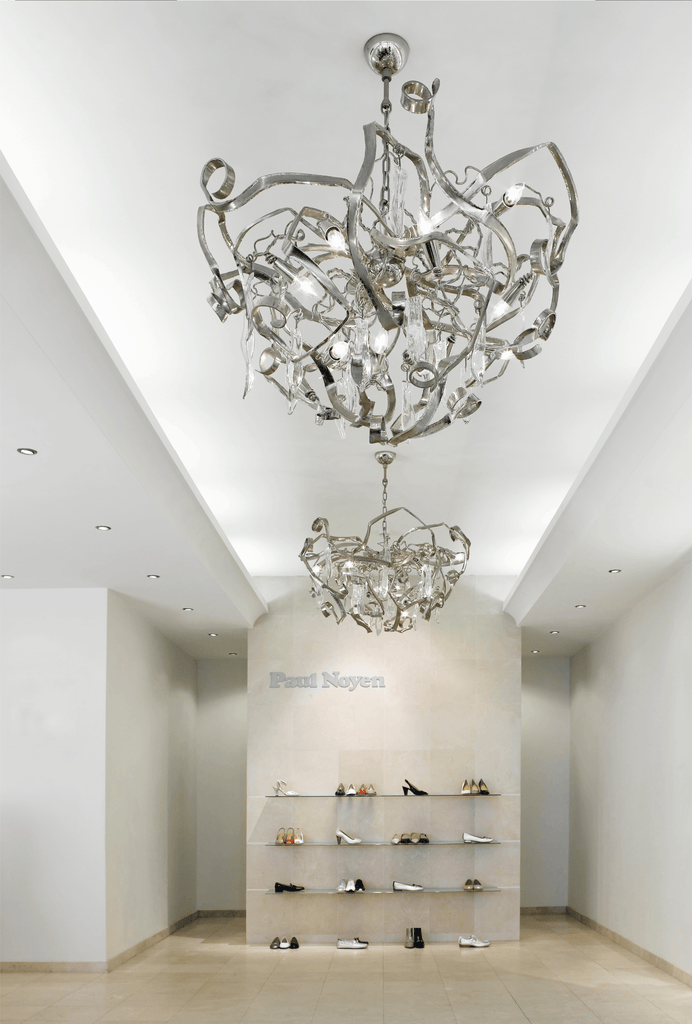 Delphinium Chandelier Round featuring an ornate multi-tiered crystal modern chandelier