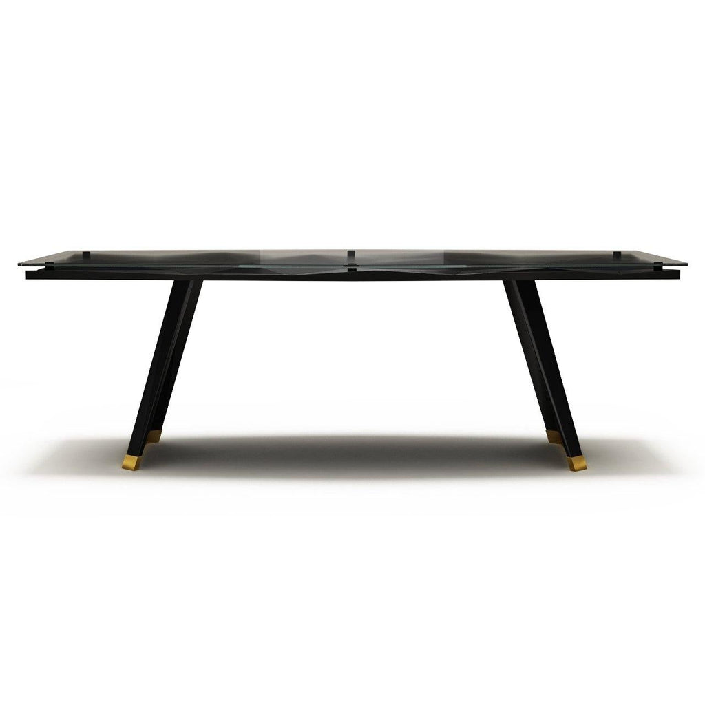 Black diamond dining table with satin base, glass top, and gold-accented angled legs