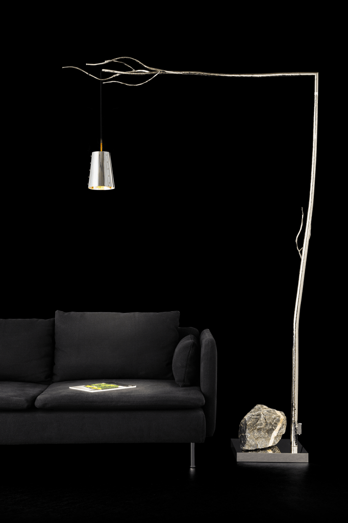 Modern Flintstone Floor Lamp with branch-like metallic frame, glass shade, and natural stone base