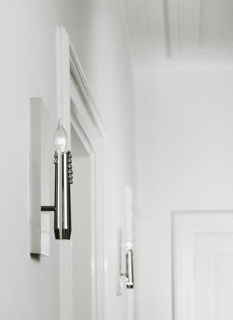 Floating candles wall lamp featuring a sleek modern design with a candle-style bulb