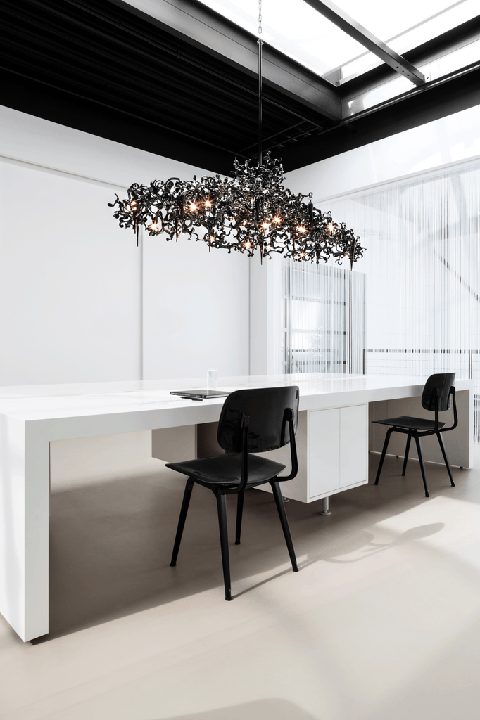 Ornate Flower Power Chandelier Oval with dark color and multiple exposed bulbs