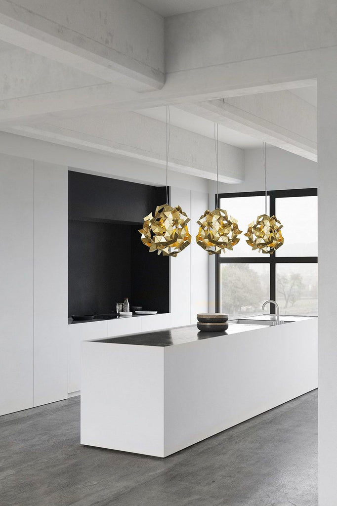 Fractal Cloud gold-colored spiky pendant lights hanging above kitchen island