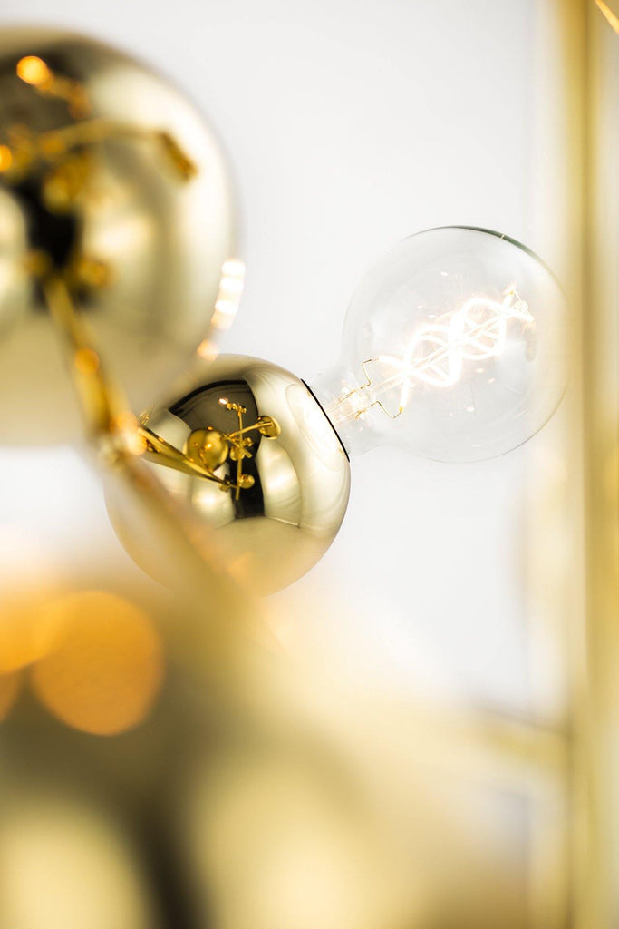 Galaxy Chandelier Round with gold spheres and illuminated spiral filament bulb