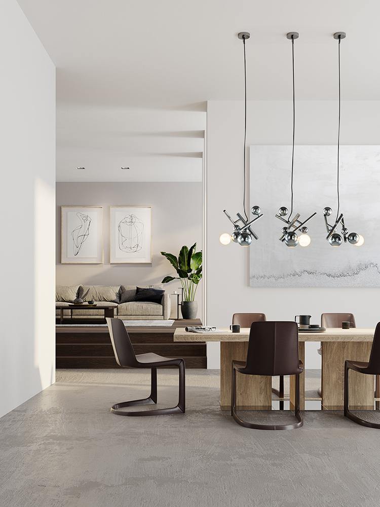 Modern dining room with light wood table dark brown chairs and Galaxy Element hanging lights