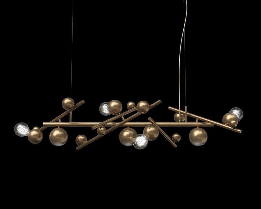 Galaxy hanging lamp with gold spheres and exposed bulbs in a modern hanging lamp long design