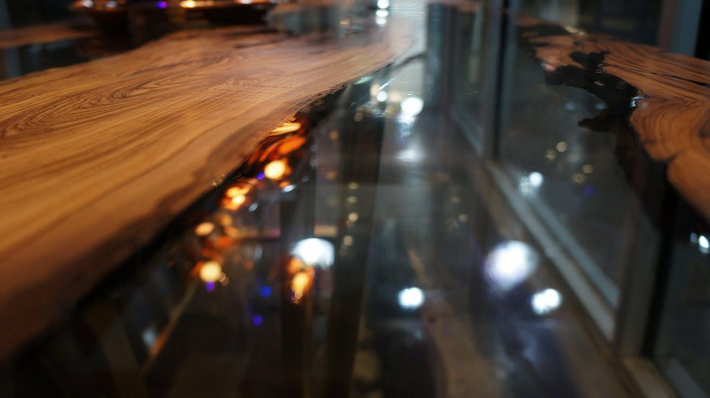 Giona Olive Dining Table featuring live-edge wood, resin river, and embedded lights