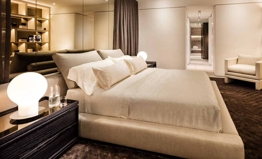 Luxurious modern Hollywood Bed bedroom with a large, neatly made bed for stylish comfort