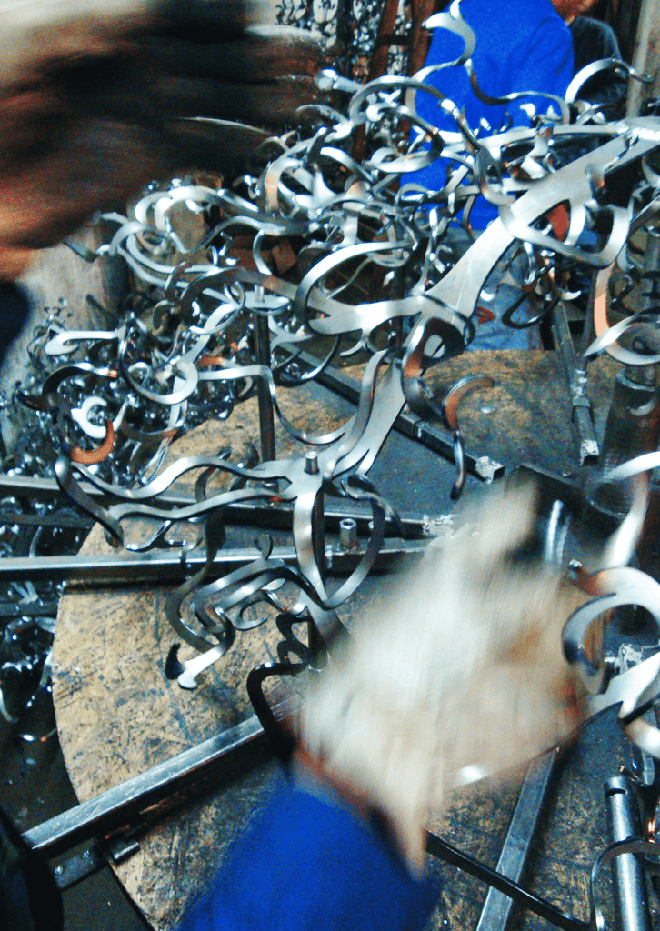 Metal shavings and scraps from machining operations for Icy Lady Hanging Lamp design