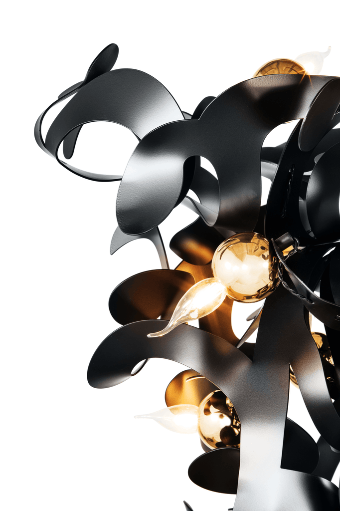 Kelp Chandelier Conical featuring black metallic shapes and glowing golden lights