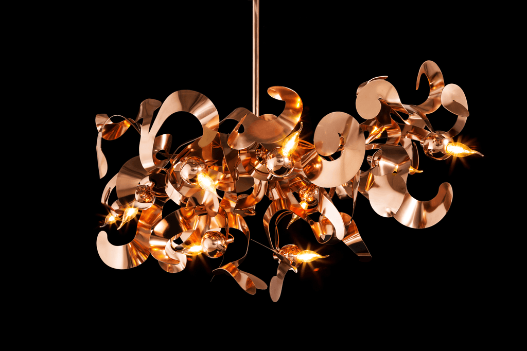 Kelp Chandelier Oval is a modern rose gold metallic chandelier with multiple lights