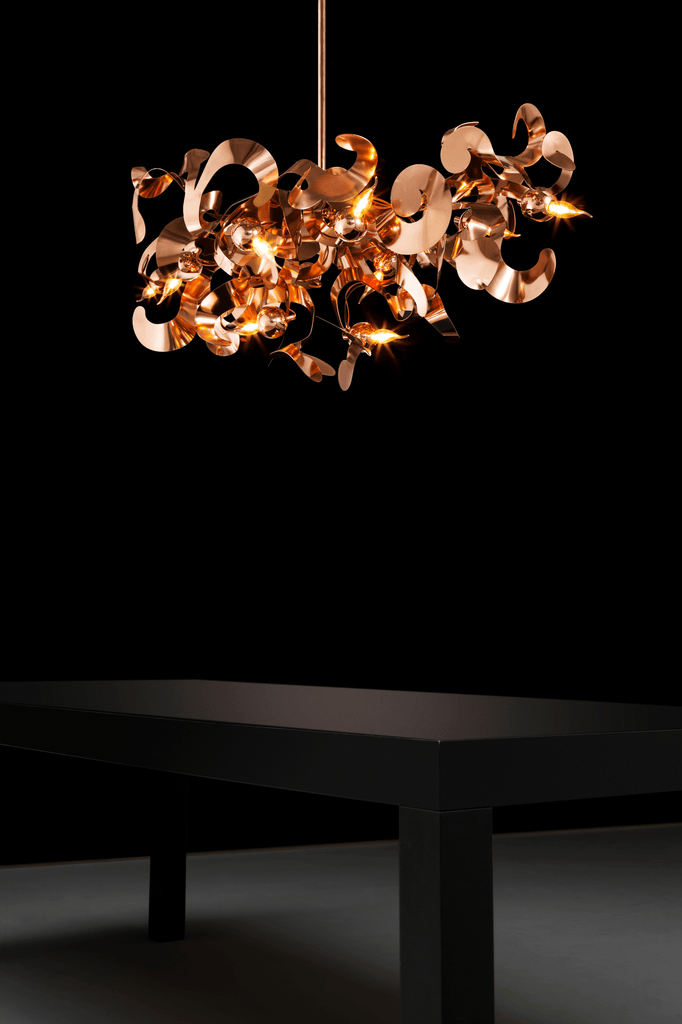 Kelp Chandelier Oval with copper finish and curved reflective elements