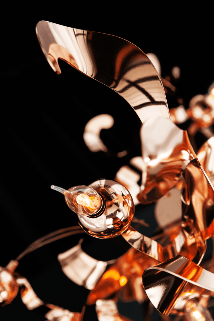 Kelp Element Hanging Lamp with shimmering copper-colored coiled design and glass light source
