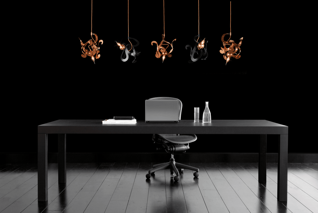 Modern office with Kelp Element Hanging Lamp, dark wood desk, ergonomic chair, pendant lights