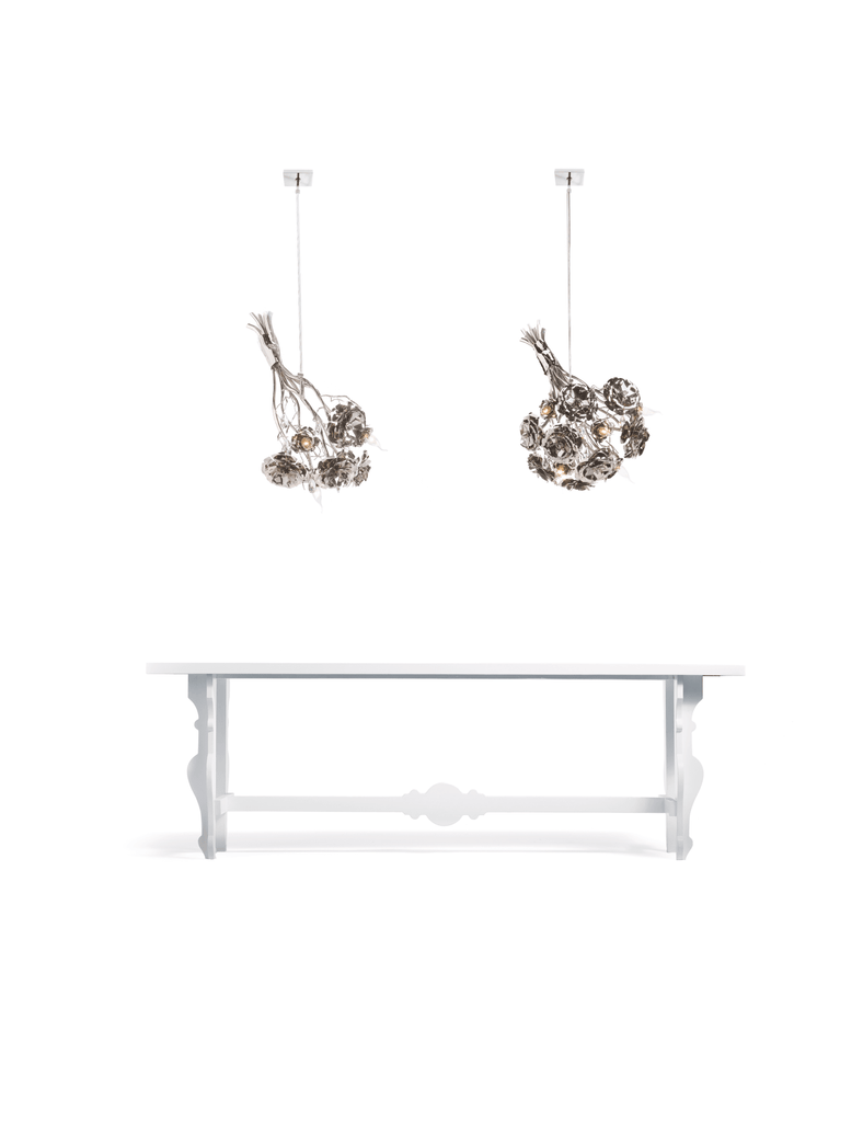 La Vie En Rosa hanging lamp bouquet featuring a white wooden console table and decorative chandeliers
