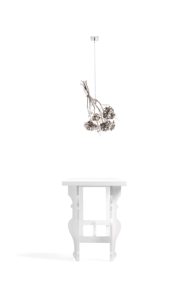 La Vie En Rosa hanging lamp bouquet with ornate chandelier and white console table