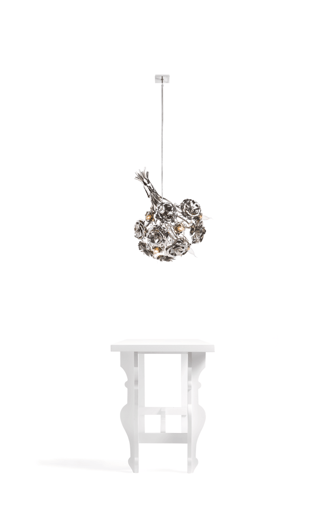 La Vie En Rosa hanging lamp bouquet featuring decorative metal chandelier and white side table