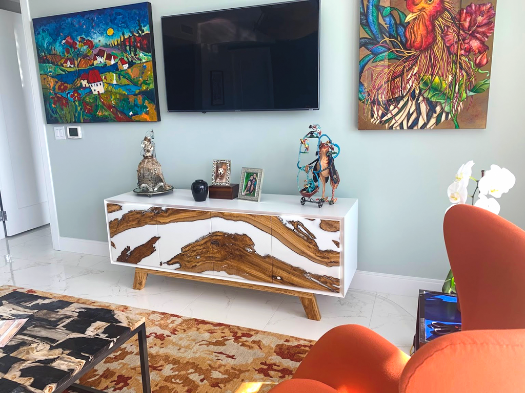 Lampetia Olive Wood Credenza with white finish, wood doors, and angled legs