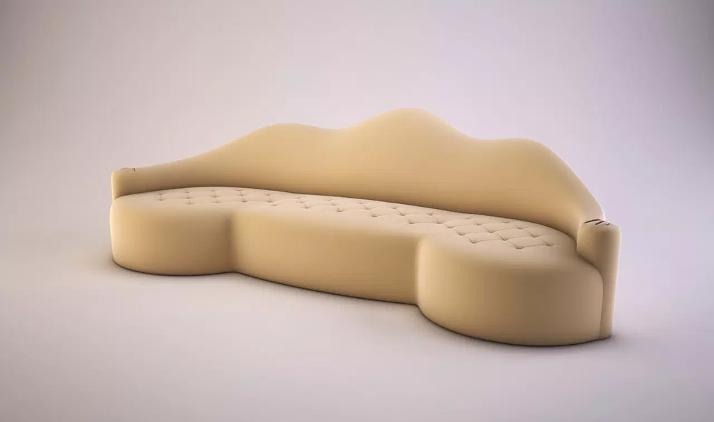 Cream-colored Lola Sofa with curved upholstery, sculpted backrest, and tufted seat