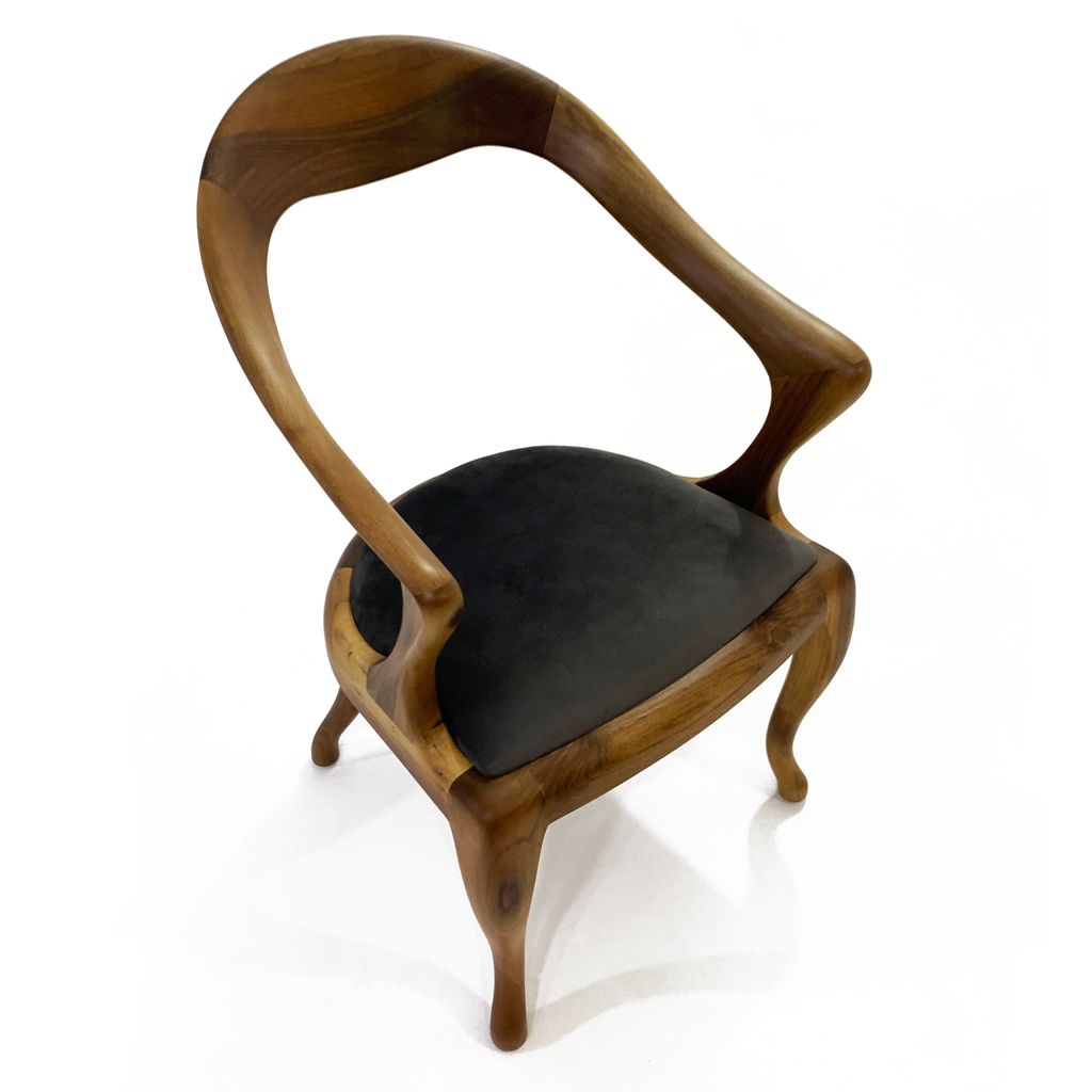 Curved wooden Maia Dining Chair with dark upholstered seat for stylish dining spaces