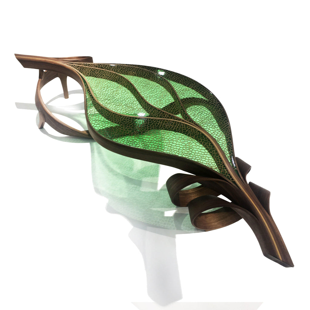 Natural Ivy Coffee Table with leaf-shaped design, dark brown wood frame, and green panels