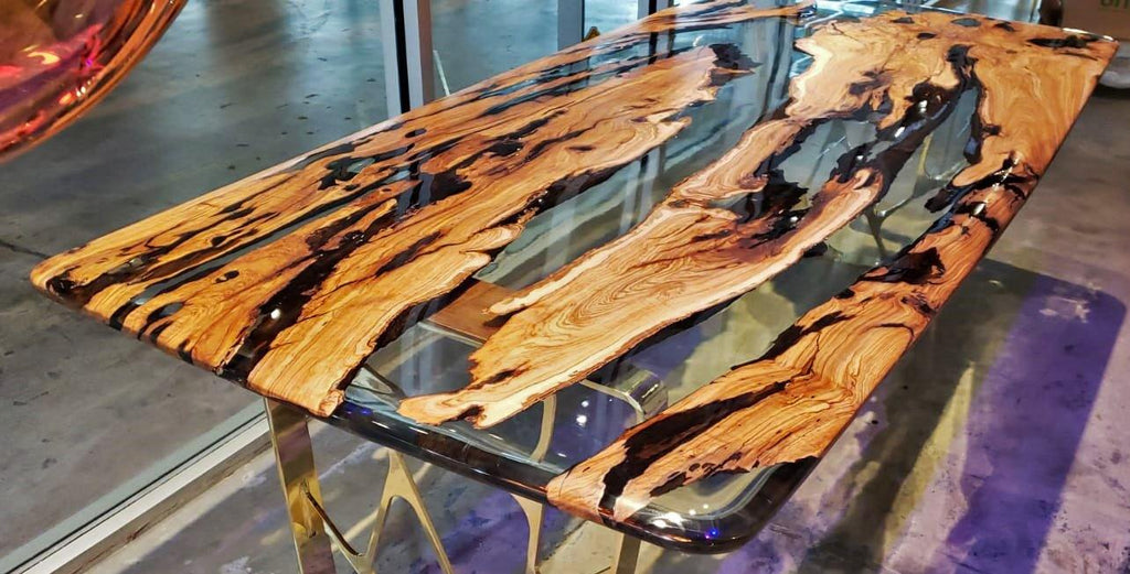 Ombrone Olive Dining Table with clear resin top and natural wood slabs