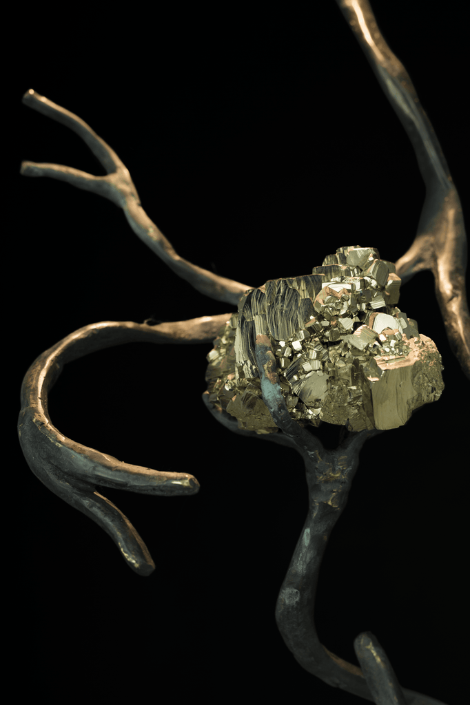 Golden pyrite crystals on dark root-like structure in Orpheus Pyrite Hanging Lamp, a semi precious stones decor
