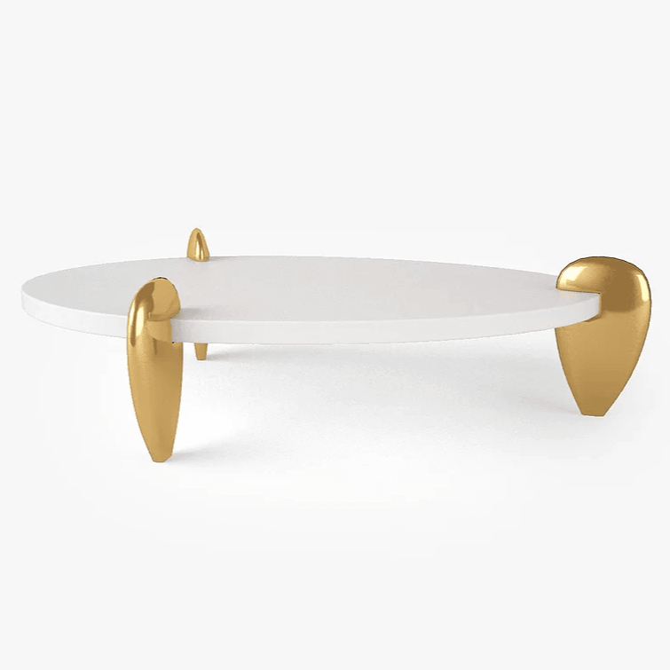White oval Remedy Cocktail Table with gold-finished teardrop legs for modern decor