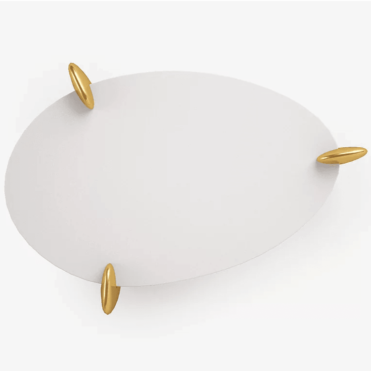 White oval Remedy Cocktail Table with gold capsule-shaped handles for stylish decor