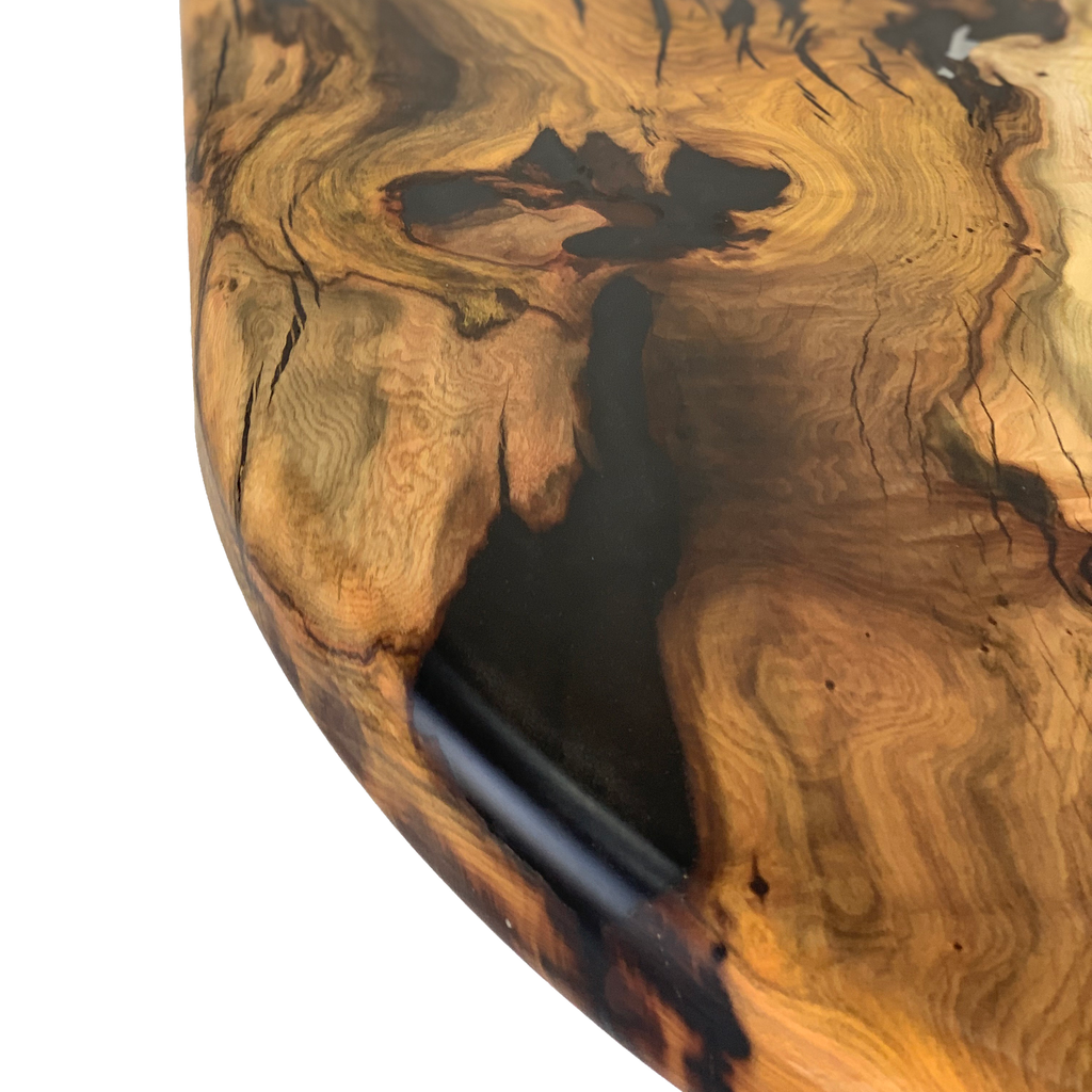 Polished walnut wood river table with dark resin infill and live edge design