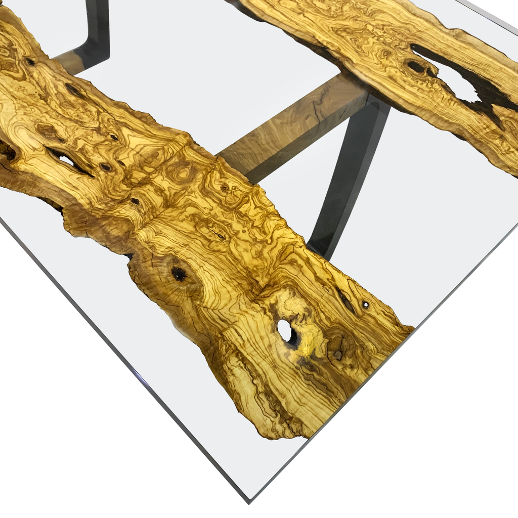 Staphyle Olive Wood Dining Table with glass top and live-edge olive wood slabs