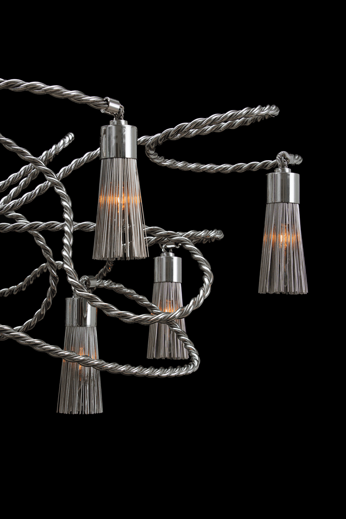 Modern swing chandelier oval with metallic tassel-like shades and intertwined arms