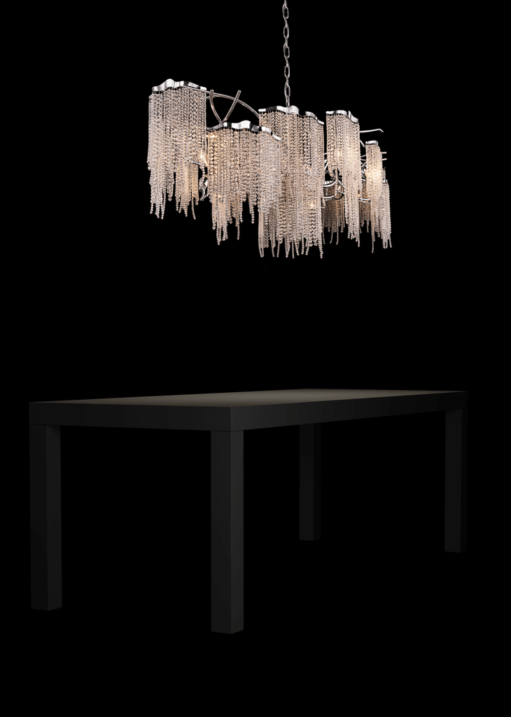 Victoria Chandelier Oval hanging above dark wood dining table with tiered draped chains